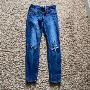 3 button low high wasted blue jeans